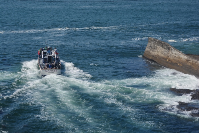 Boat leaving Depoe Bay harbor